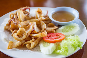 Fried squid with spicy sauce.
