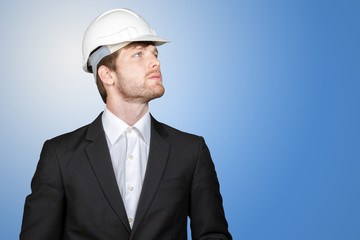 Businessman holding white hardhat