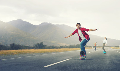 Fototapeta na wymiar Teenagers ride skateboards . Mixed media