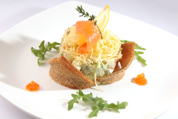 Russian salad with smoked salmon and toast