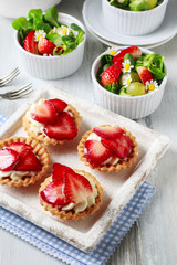 Strawberry cakes and healthy salad