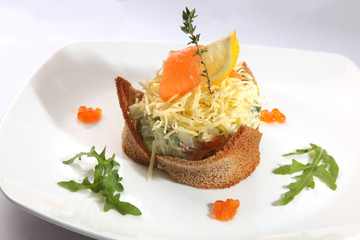 Russian salad with smoked salmon and toast