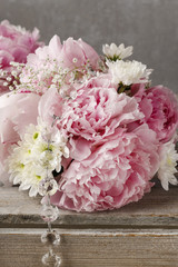 Floral arrangement with pink peonies, white hortensia, chrysanth