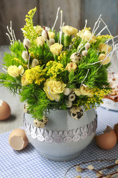 Bouquet of yellow and green carnations in ceramic vase