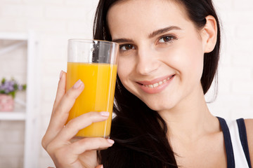 Woman drinking orange juice Beautiful mixed-race Asian, Caucasian model.