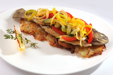 Roast fish with potatoes and vegetables