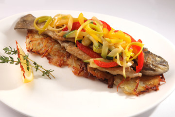Roast fish with potatoes and vegetables