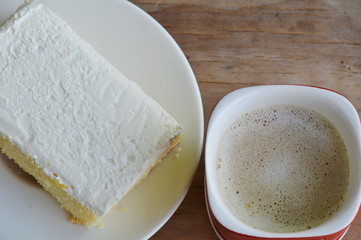 vanilla flavor milk cream cake on dish and coffee