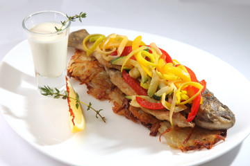 Roast fish with potatoes and vegetables