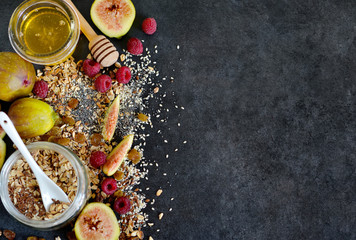 Morning breakfast - granola, honey, berries and fruits. Black co
