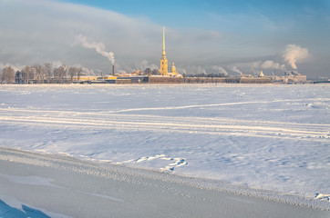 Saint Petersburg, Russia. A view of the frozen Neva river Peter and Paul fortress from the Spit of Vasilievsky island at a hazy frosty winter day.