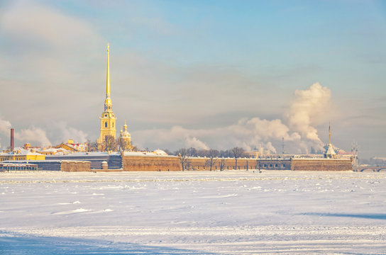 Saint Petersburg, Russia. The St. Peter and Paul fortress at a hazy frosty winter day. Shot from the Spit of Vasilievsky island.