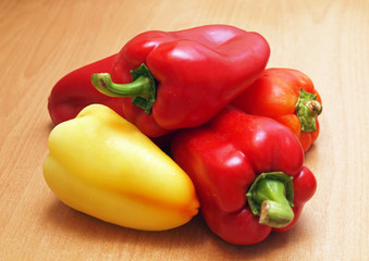 Large colorful sweet pepper on a wooden surface