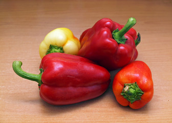 Large colorful sweet pepper on a wooden surface