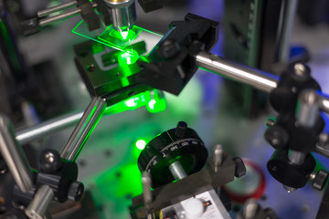 green lasers in the laboratory, laser beams among the optical elements, the study of light and cognitive phenomena