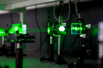 green lasers in the laboratory, laser beams among the optical elements, the study of light and cognitive phenomena