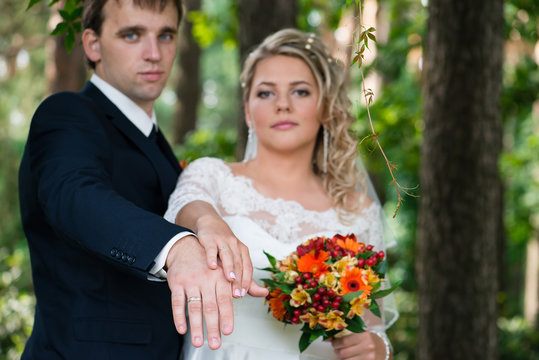 wedding photography, newlyweds, couple with rings on his hands