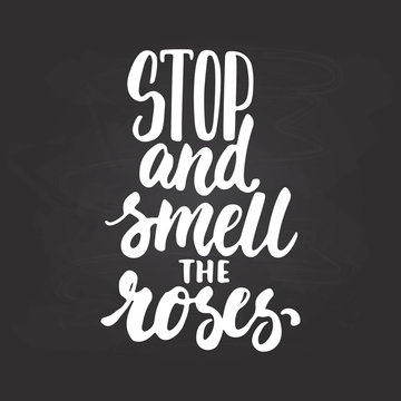 Stop and smell the roses - hand drawn lettering phrase isolated on the chalkboard background. Fun brush ink inscription for photo overlays, greeting card or t-shirt print, poster design