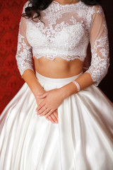 Young bride in wedding dress. Women's hands, closeup