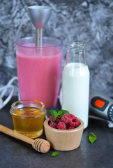 Berry smoothie for breakfast with honey and raspberry