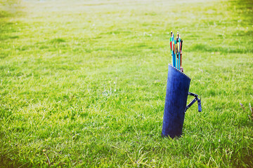 quiver of arrows outdoors. leather tube quiver arrow. empty space for your text