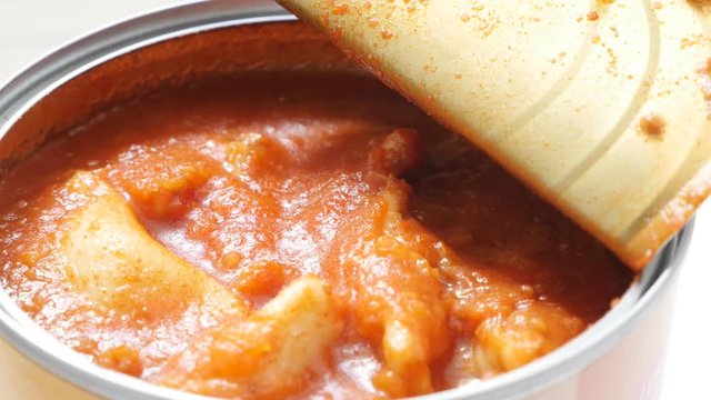 Ravioli canned food ready to eat meal close-up 4K 2160p 30fps UltraHD footage - Can opener shallow DOF of ravioli lunch container 4K 3840X2160 UHD video