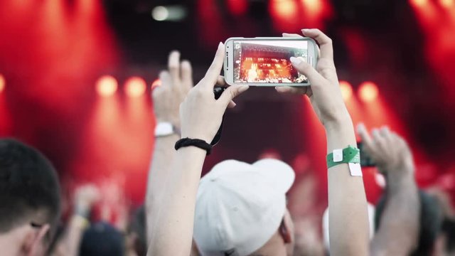 People on a concert. Video recording with smartphone