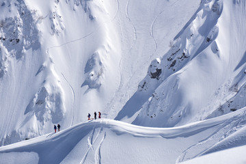 Snowboard freeride, snowboarders and tracks on a mountain slope. Extreme sport.