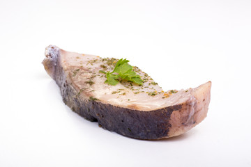 a piece of fish on a white background, photo studio, isolated, herbs, meal