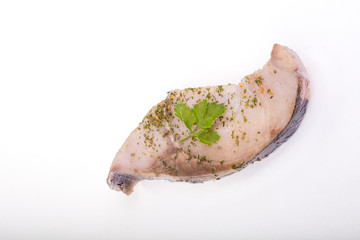 a piece of fish on a white background, photo studio, isolated, herbs, meal