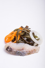 a piece of fish on a white background, photo studio, isolated, herbs, meal