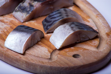 a piece of fish on a white background, photo studio, isolated, herbs, meal