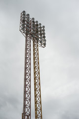 a big stadium light,lamp post ,electricity industry or Sports lighting against cloudy sky in background