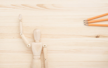 Wooden figure and office supplies