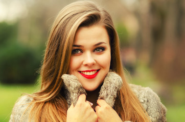 Beautiful glamorous lady having fun in autumn nature