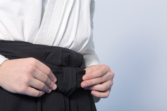 Hands Of A Teenager Tie A Hakama