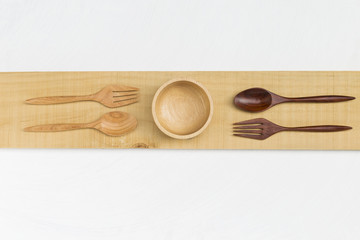 Wooden cutlery with space on white background