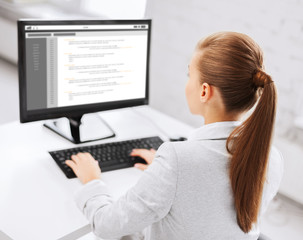 businesswoman with coding on computer at office