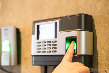 Woman's finger print scan for enter security system