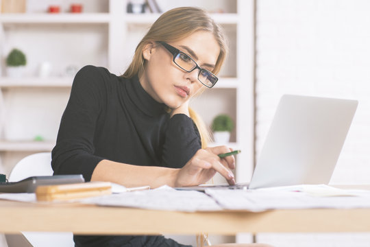 Businesslady using laptop at desk