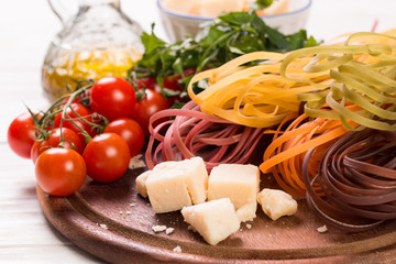  Vegetable color Pasta, oil,tomatoes,cheese on wooden table. italian food