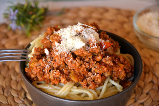 Spaghetti bolognese with meat sauce and parmesan