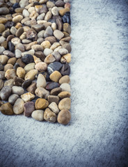 Stones on stone background, concept of harmony and tranquility. Decoration with stone pebbles as natural design backdrop with copy space.