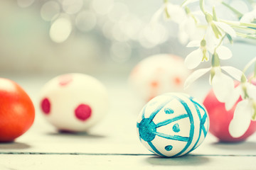 Easter concept with colorful eggs on wooden background