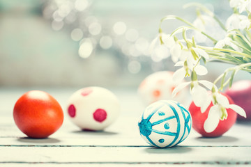 Easter concept with colorful eggs on wooden background
