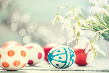 Fototapeta na wymiar Easter concept with colorful eggs on wooden background