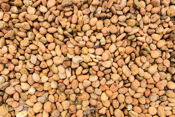 Orange brown rock pebbles background