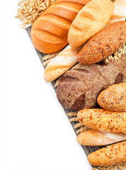 Composition with bread and rolls in wicker basket