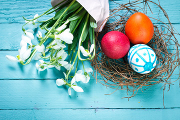 Easter concept with colorful eggs on wooden background