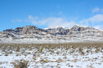 Nevada Mountains Along Highway 15. Snow capped mountain tops as seen along US interstate 15,...